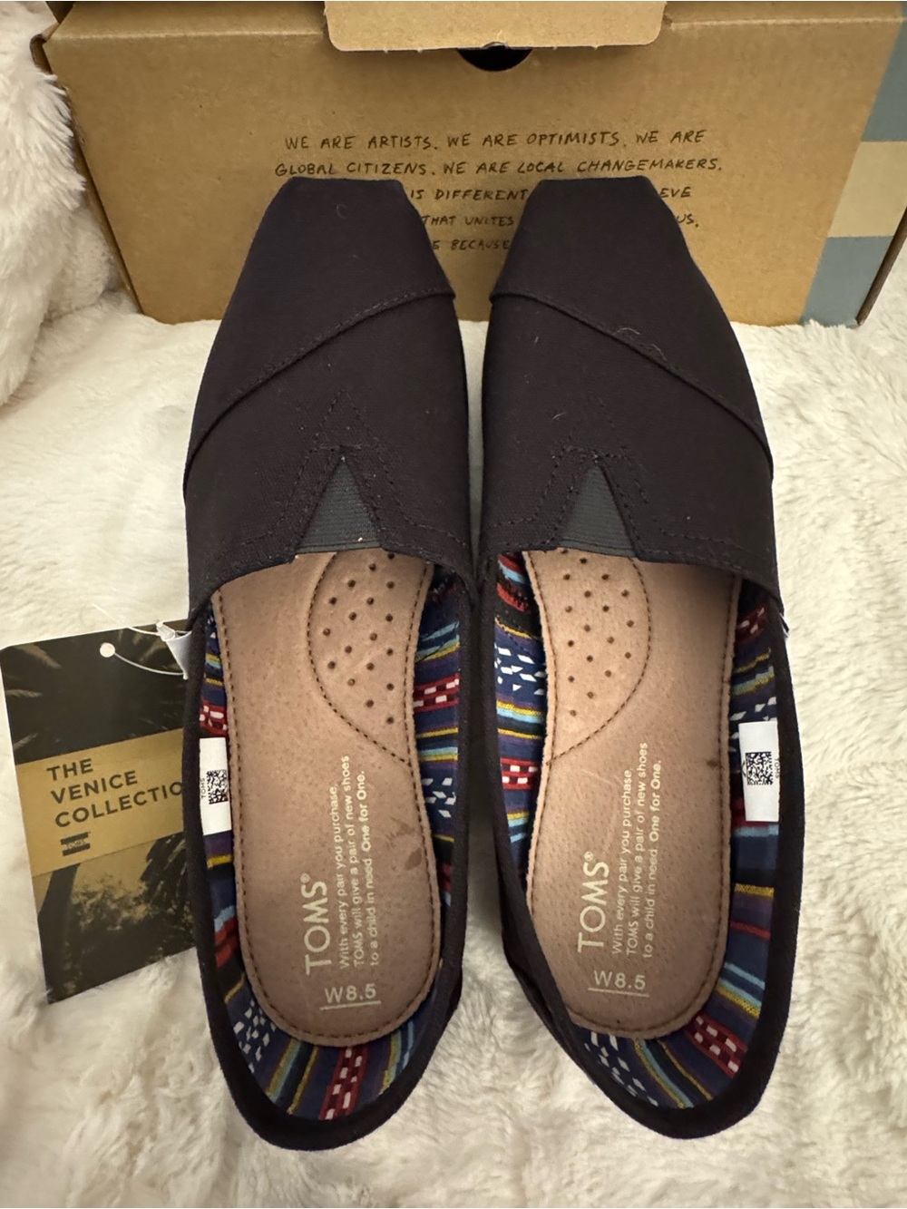 TOMS Black Canvas Women’s Slip-On Flats with Patterned Lining